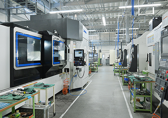The second plant‘s production line is lined with Okuma vertical machining centers, including the MB-80V and the GENOS M series.
